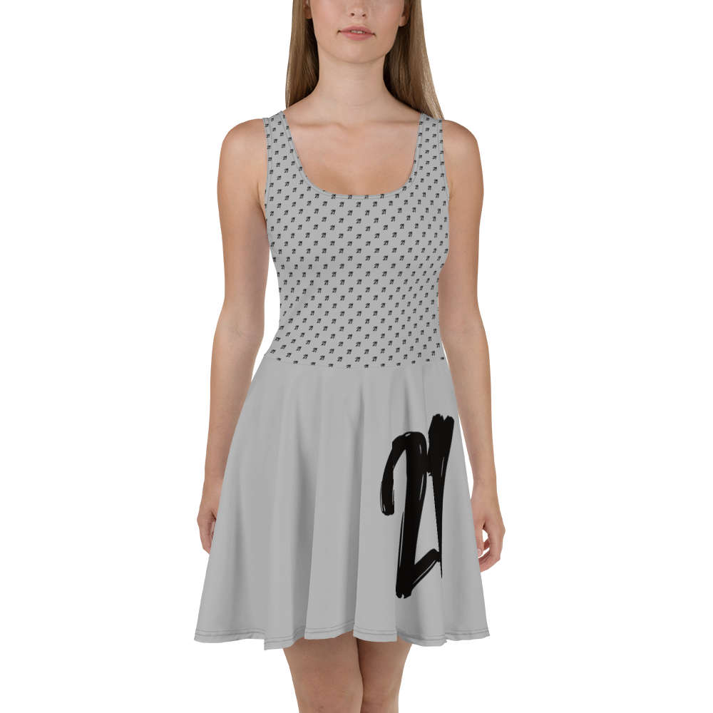 Front view of a woman wearing a silver bitcoin skater dress.