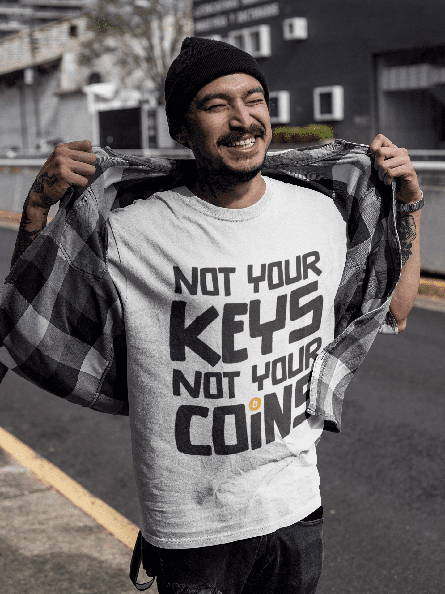 Smiling tattooed asian man wearing a white round neck bitcoin t-shirt-outdoors.