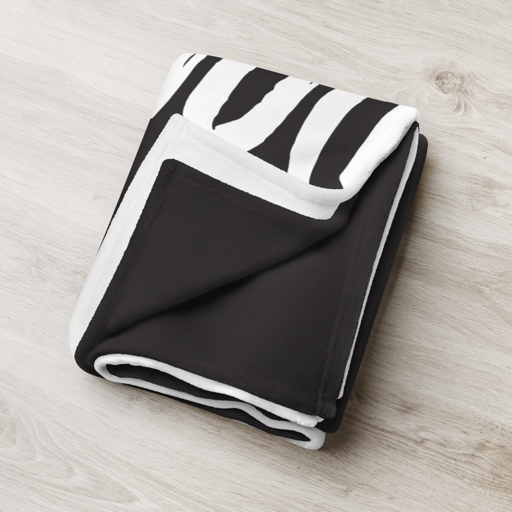 Detailed view of the folded black bitcoin blanket.