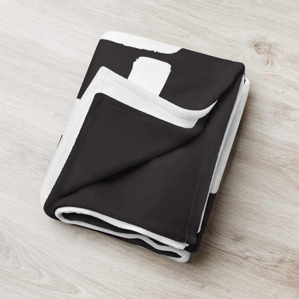 Detailed view of the folded black bitcoin blanket.