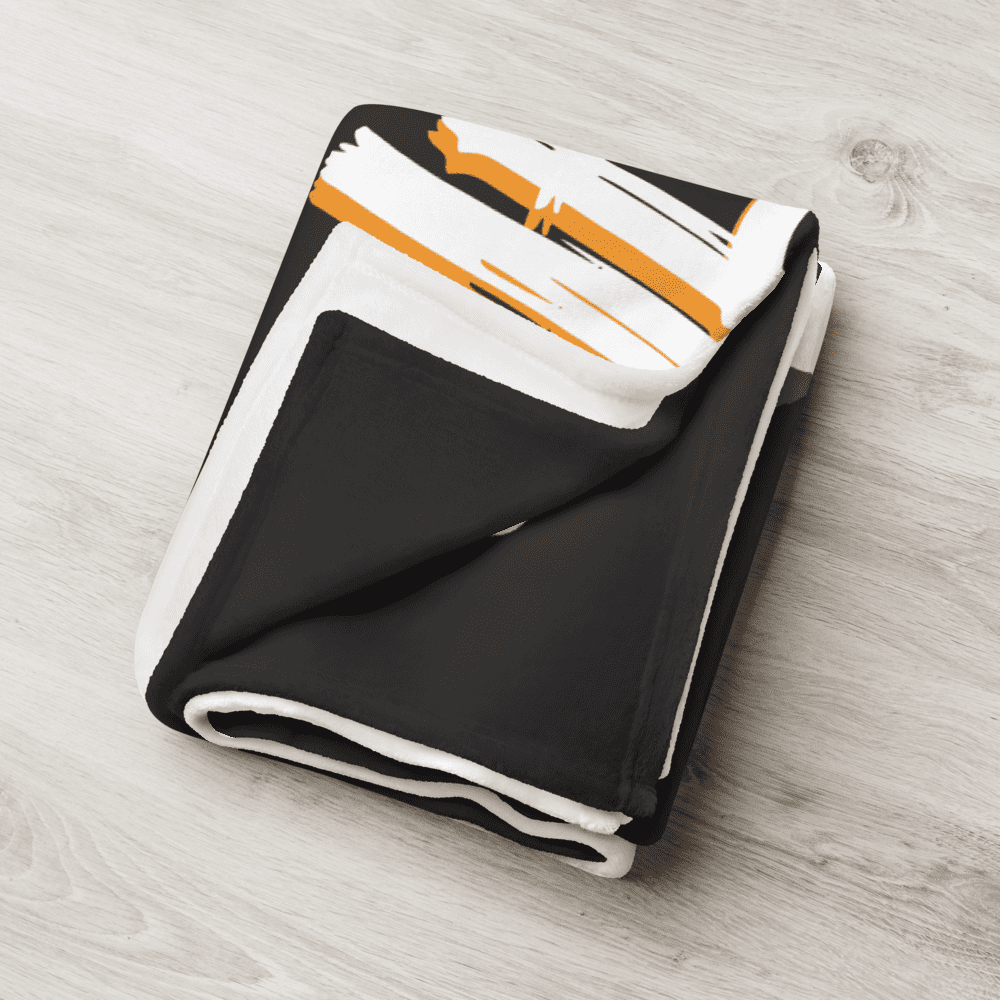 Detailed view of the folded black bitcoin blanket.