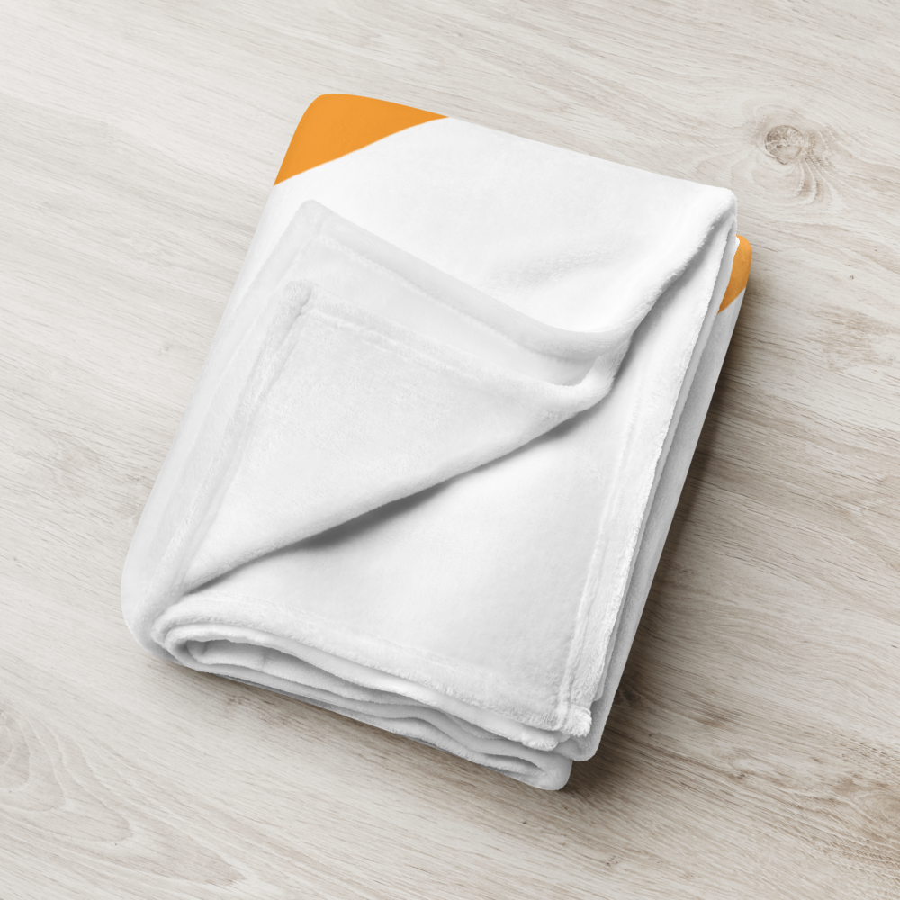 Detailed view of the folded white bitcoin blanket.