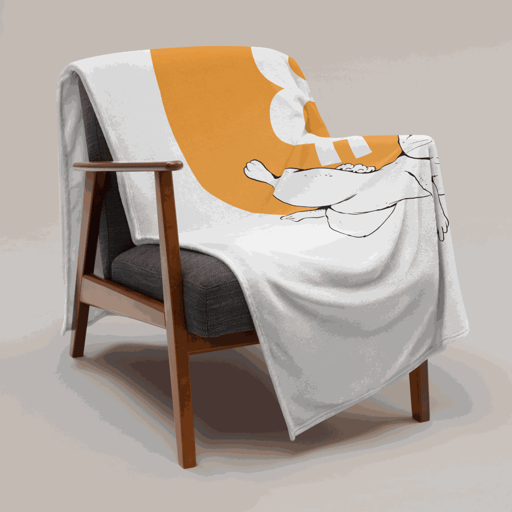 White bitcoin blanket hanging over an armchair.