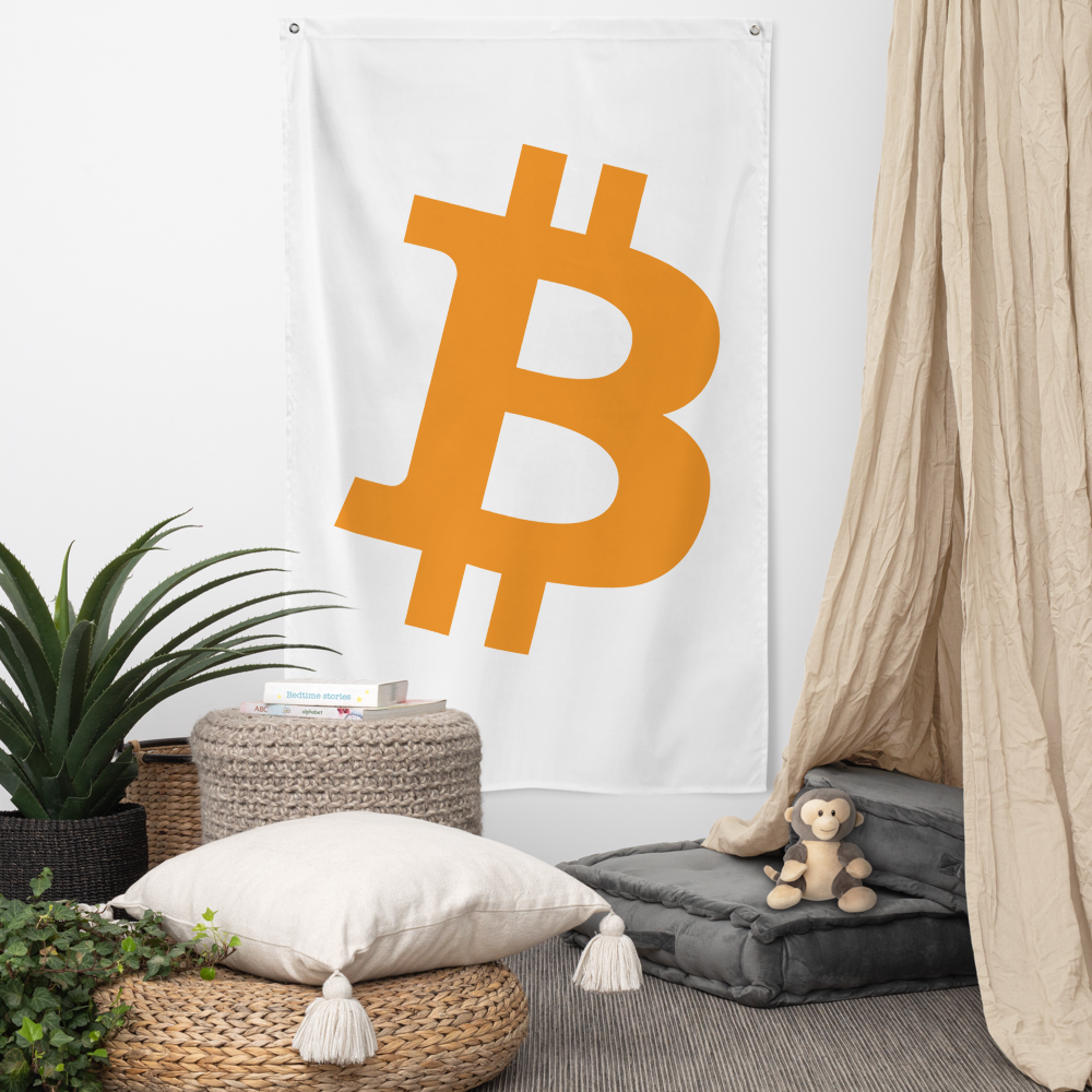 View of a white bitcoin flag hanging in a living room.