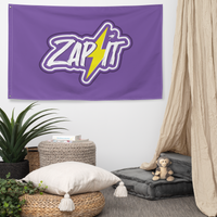 Zap It nostr flag, hanging on a wall above a seating corner.
