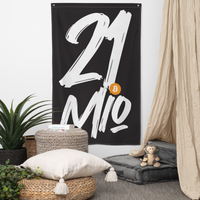21 Million bitcoin flag, hanging on a wall above a seating corner.