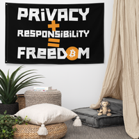 Privacy + Responsibility = Freedom bitcoin flag, hanging on a wall above a seating corner.