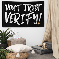 Don't Trust Verify! bitcoin flag, hanging on a wall above a seating corner.