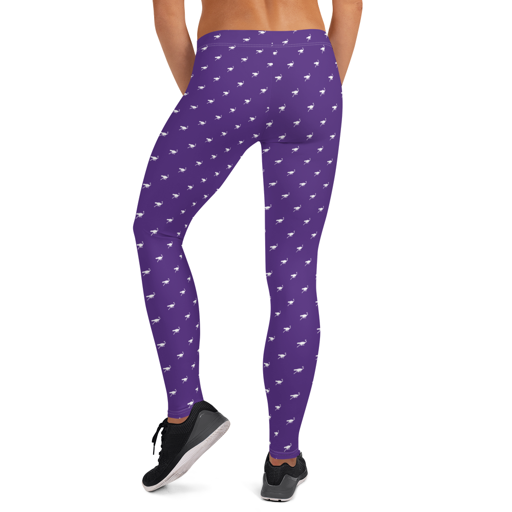 Back view of a woman wearing purple nostr leggings.