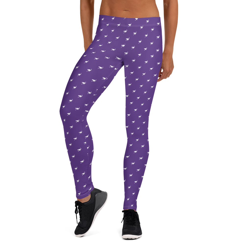 Front view of a woman wearing purple nostr leggings.