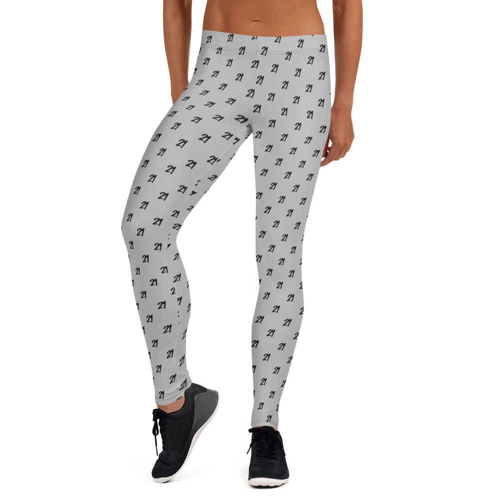 Front view of a woman wearing grey bitcoin leggings.