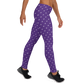 Side view of a woman wearing purple nostr leggings.