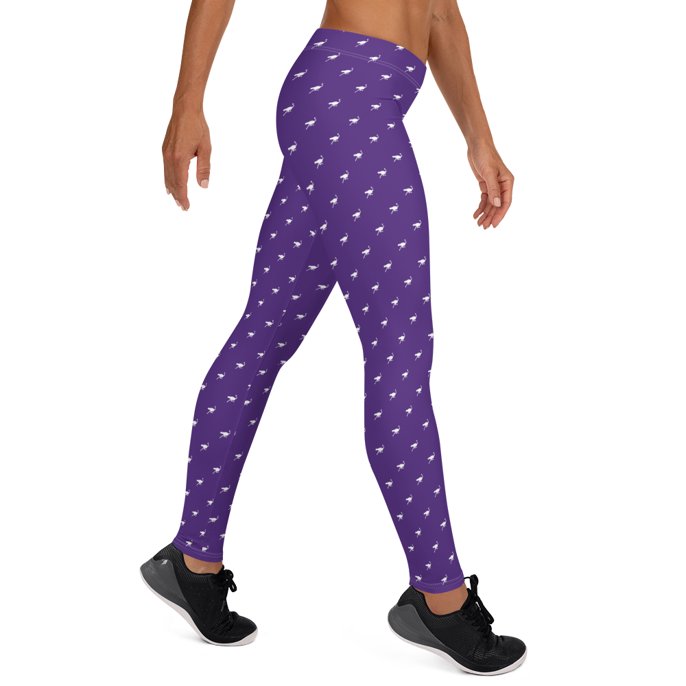 Side view of a woman wearing purple nostr leggings.