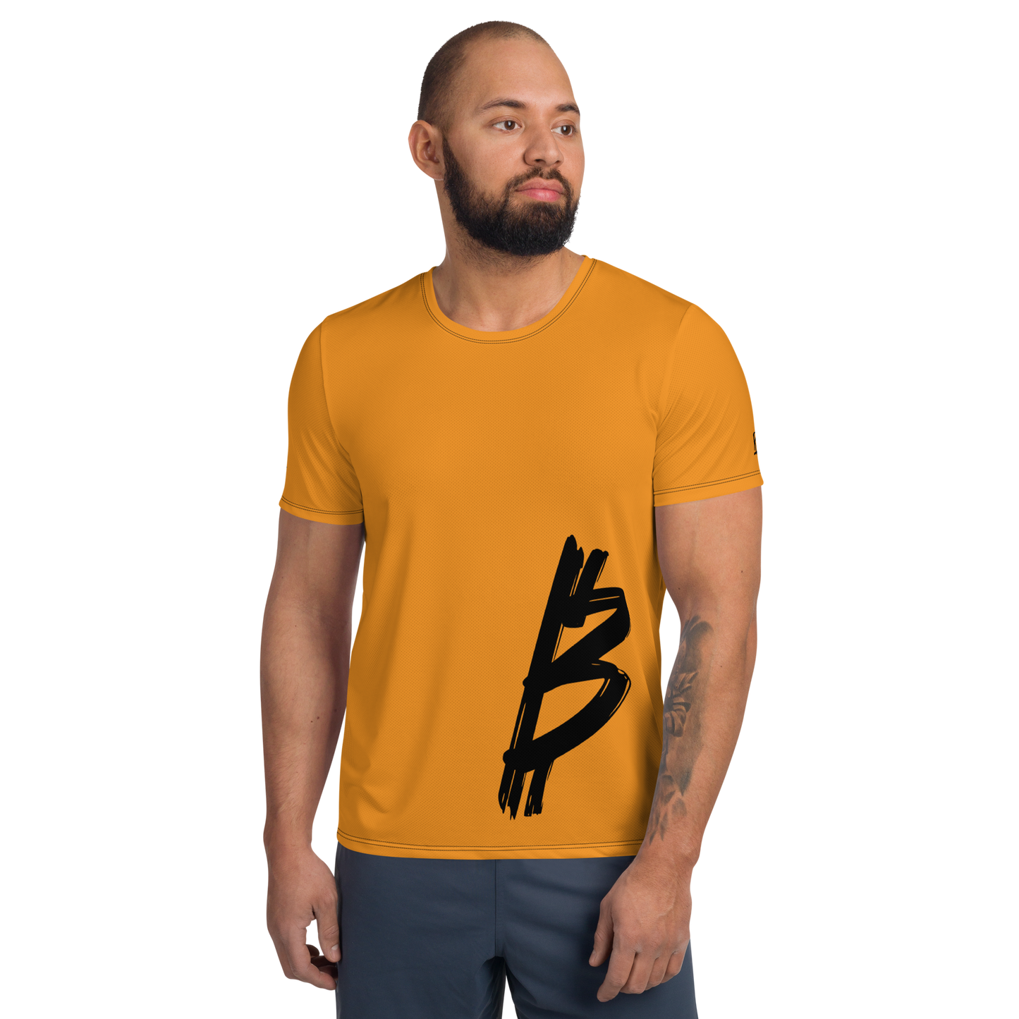 Front view of a man wearing an orange bitcoin athletic shirt for men.