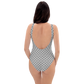 Back view of a woman wearing a silver grey bitcoin swimsuit.