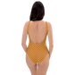 Back view of a woman wearing an orange bitcoin swimsuit.