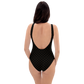 Back view of a woman wearing a black bitcoin swimsuit.