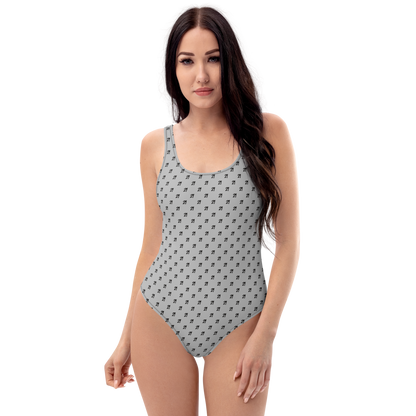 Front view of a woman wearing a silver grey bitcoin swimsuit.