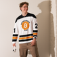 Front view of a man wearing a bitcoin hockey jersey.