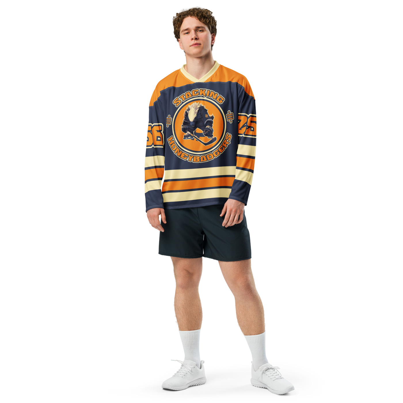 Stacking Honey Badgers bitcoin hockey jersey, front view: a navy hockey jersey with orange shoulders, cream stripes and the Stacking Honey Badgers crest.