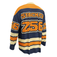 Stacking Honey Badgers bitcoin hockey jersey, left back view: a navy hockey jersey with orange shoulders, cream stripes and the Stacking Honey Badgers crest.