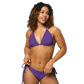 Front view of a woman wearing a purple nostr bikini.