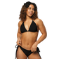 Front view of a woman wearing a black bitcoin bikini.