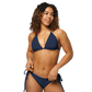 Front view of a woman wearing a navy blue bitcoin bikini.