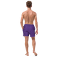 Back view of a man wearing a purple nostr swim trunks.