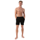 Front view of a man wearing a black bitcoin swim trunks.