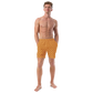 Front view of a man wearing an orange bitcoin swim trunks.