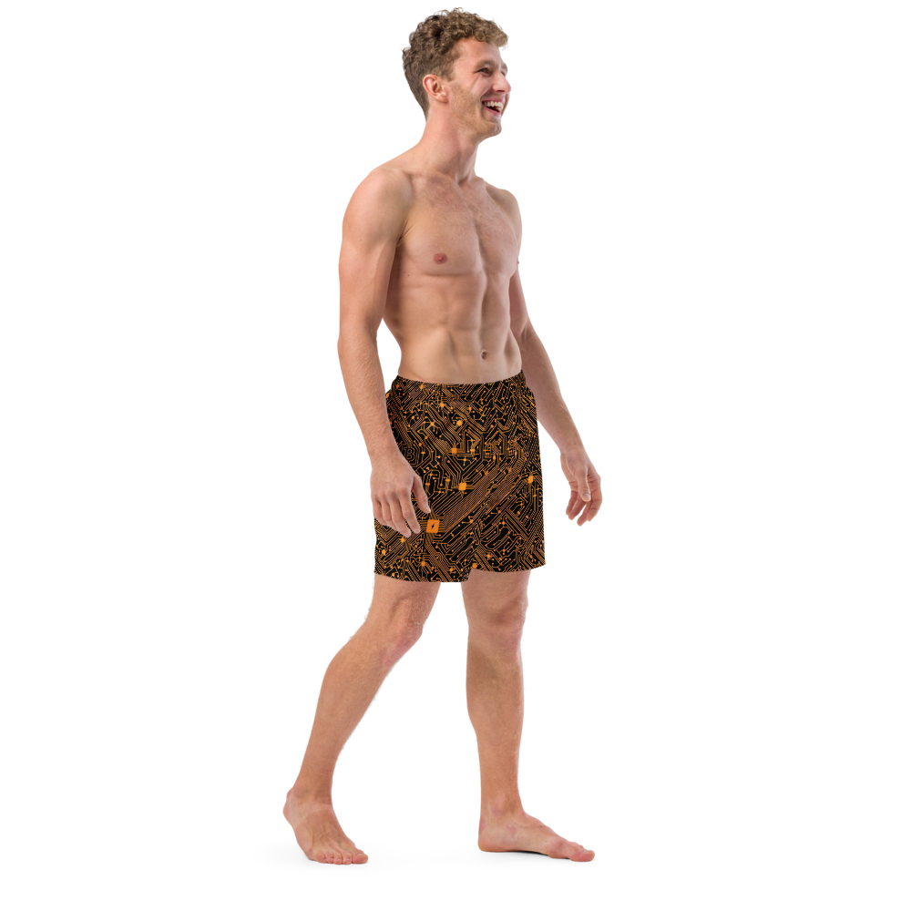 Side view of a man wearing a black bitcoin swim trunks.