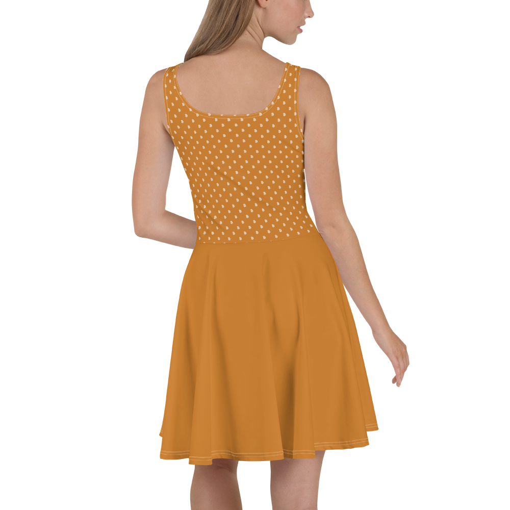 Back view of a woman wearing an orange bitcoin skater dress.