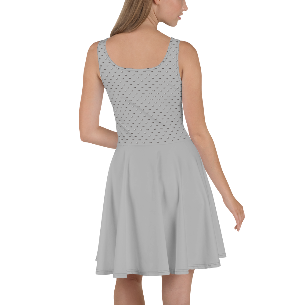 Back view of a woman wearing a silver bitcoin skater dress.