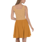 Back view of a woman wearing an orange bitcoin skater dress.