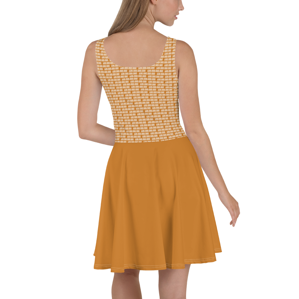 Back view of a woman wearing an orange bitcoin skater dress.