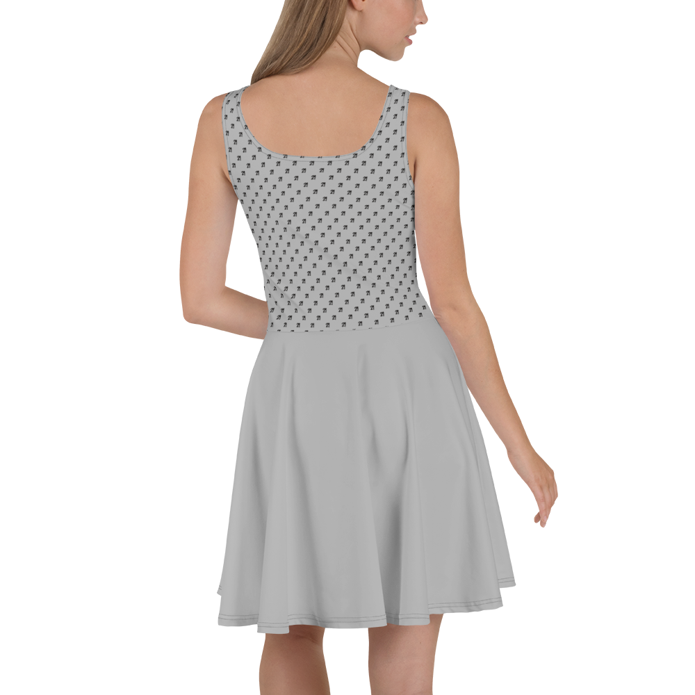 Back view of a woman wearing a silver bitcoin skater dress.