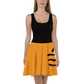 Front view of a woman wearing a black and orange bitcoin skater dress.