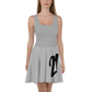 Front view of a woman wearing a silver bitcoin skater dress.