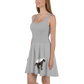 Side view of a woman wearing a silver bitcoin skater dress.