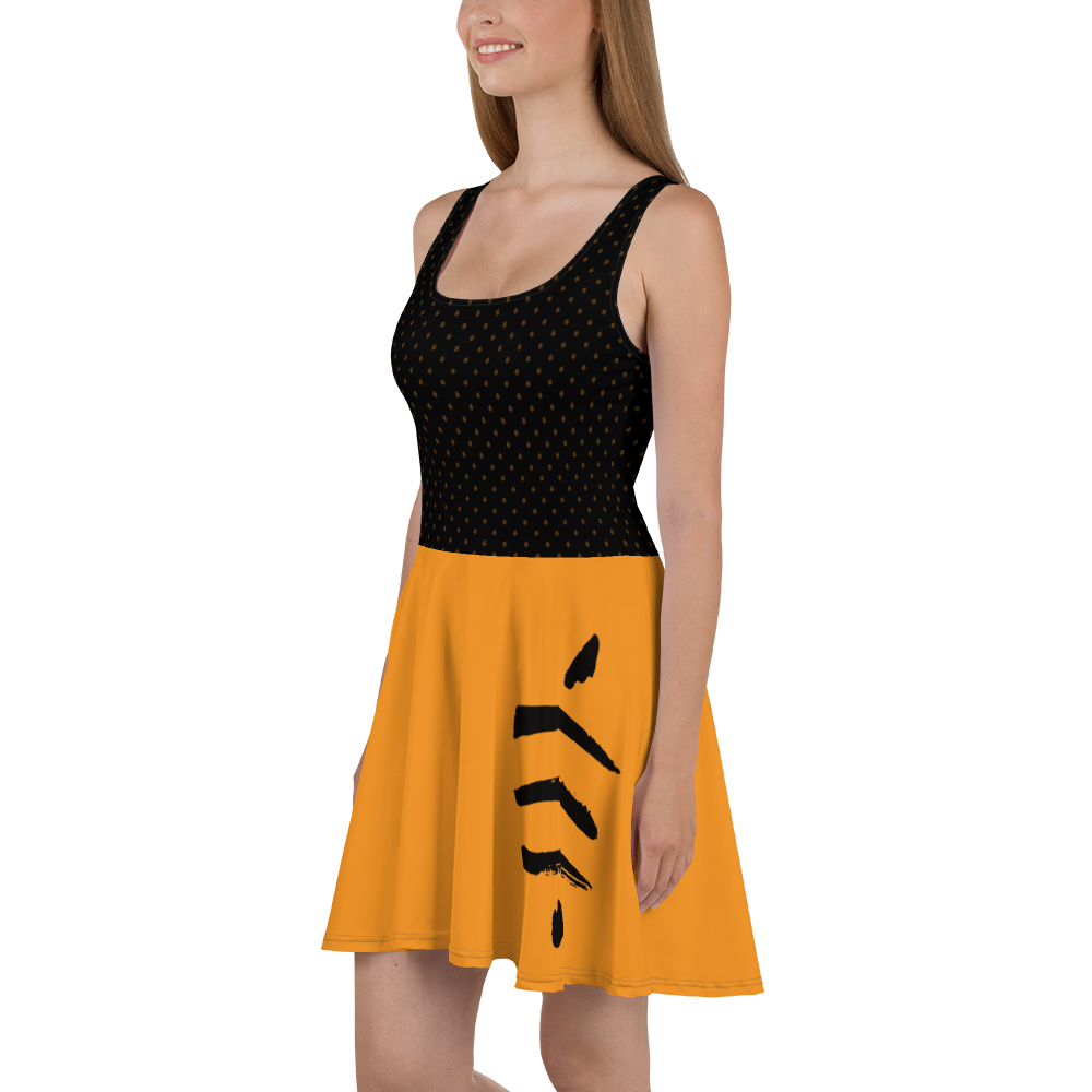 Side view of a woman wearing a black and orange bitcoin skater dress.