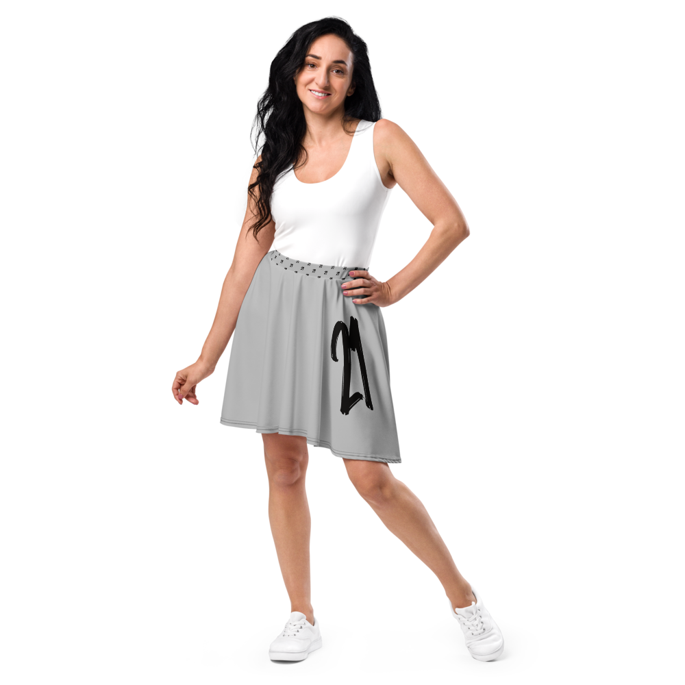 Front view of a woman wearing a silver grey bitcoin skirt.