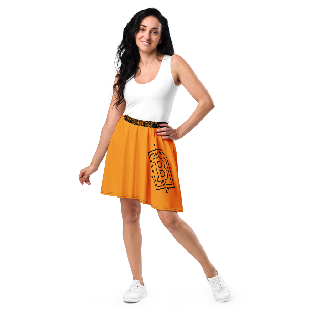 Front view of a woman wearing an orange bitcoin skirt.