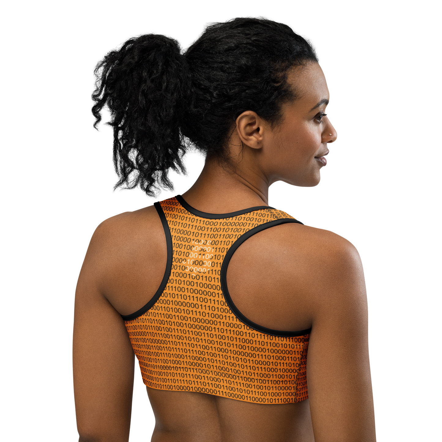 Back view of a woman wearing an orange bitcoin sports bra.