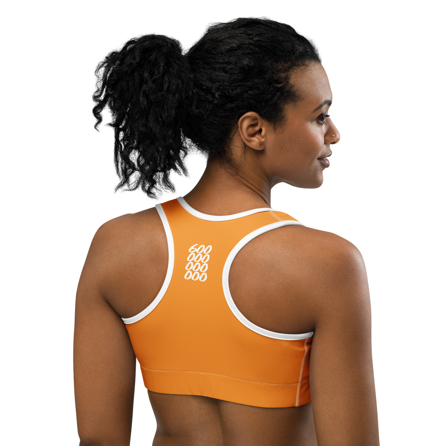 Back view of a woman wearing an orange bitcoin sports bra.