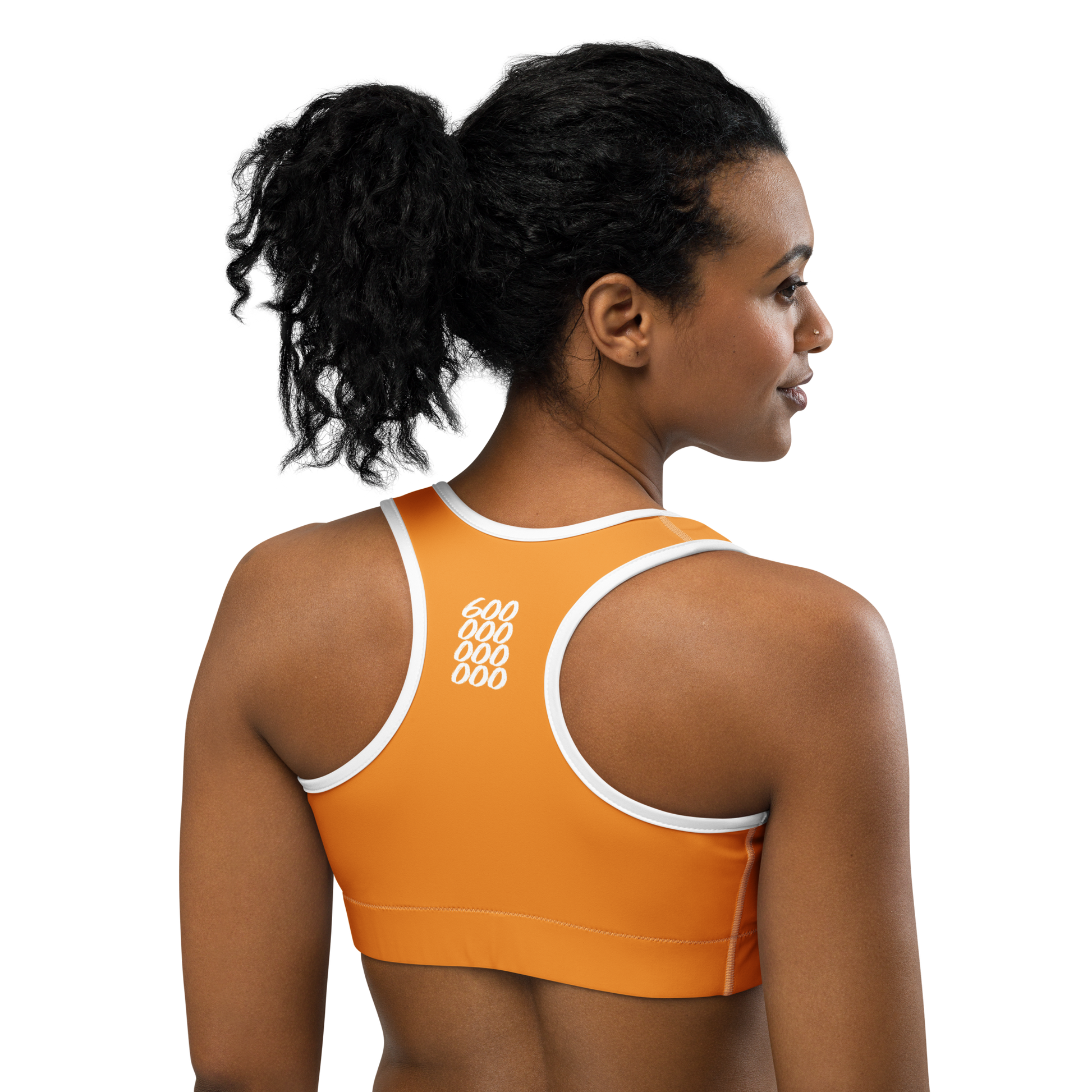 Back view of a woman wearing an orange bitcoin sports bra.