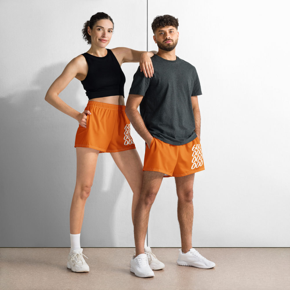 Front view of a man and a woman wearing orange bitcoin athletic shorts.