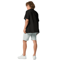 Back view of a man wearing a black bitcoin button shirt.