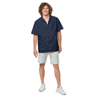 Front view of a man wearing a navy blue bitcoin button shirt.