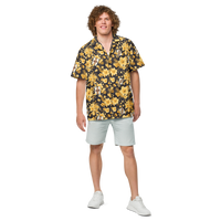 Michael Monday anarcho late night button shirt, front view: a black hawaiian pattern of yellow hibiscus flowers, palm leaves and small Michael Monday portraits.